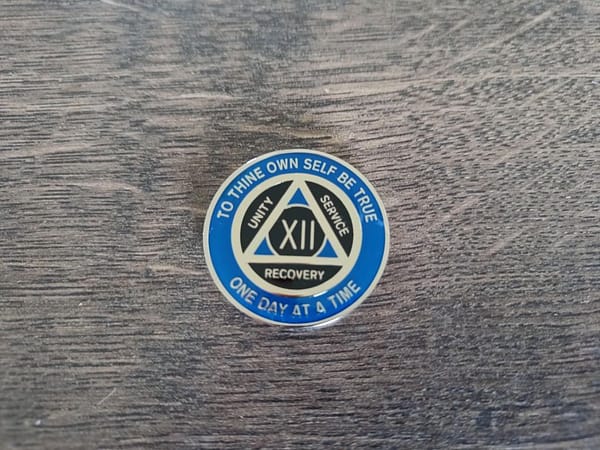 AA mønt 12 år, tri-plate