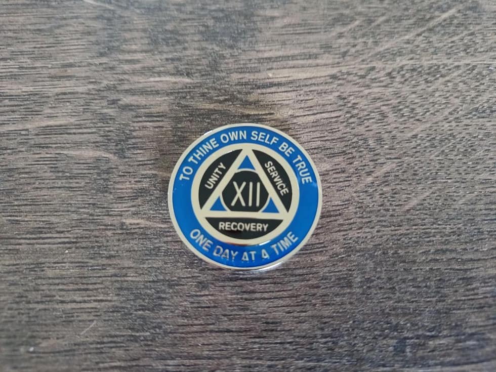 AA mønt 12 år, tri-plate